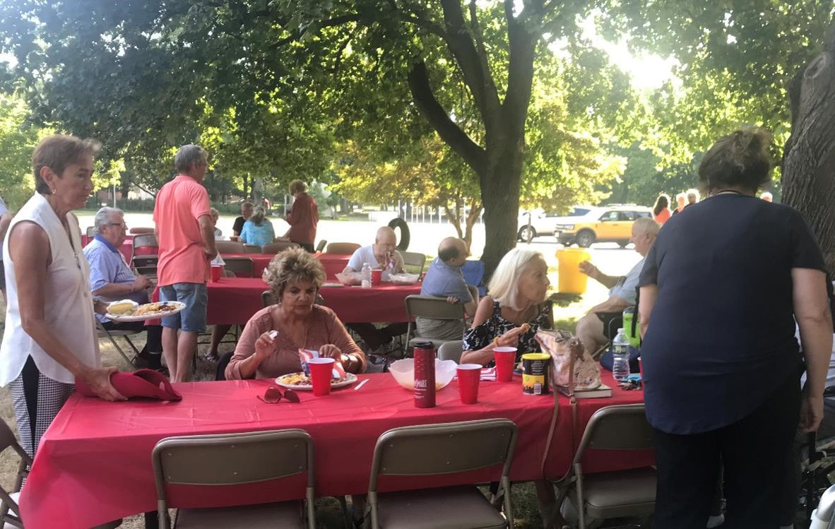 People enjoying fellowship and food at the annual picnic at PVURC.