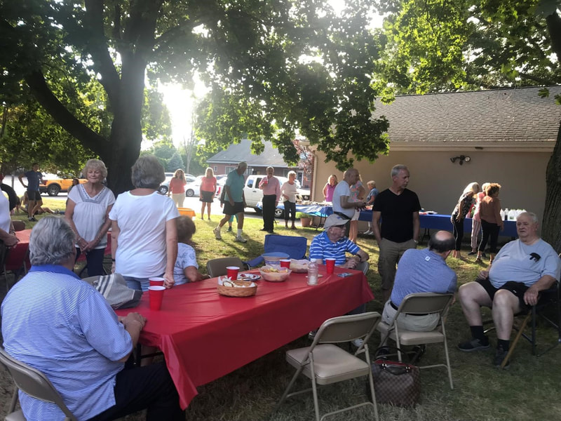 People enjoying fellowship and food at the annual picnic at PVURC.