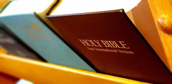 Image of Bible and hymnals in a pew at Preakness Valley United Reformed Church