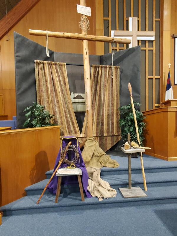 A Good Friday diorama display showing the cross, veil, hammer, nail and crown of thorns. 